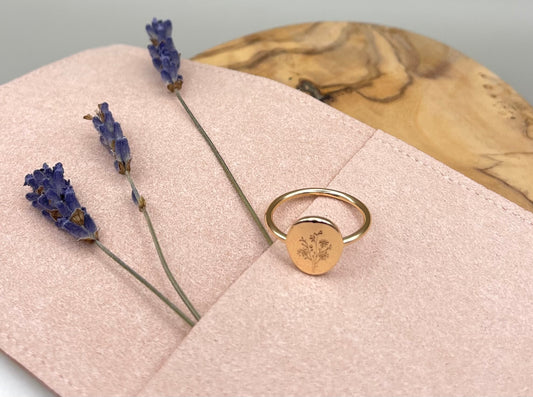 Gold ring with disc and engraved wildflowers. Gift for mother. Pictured with pink microfiber pouch. 